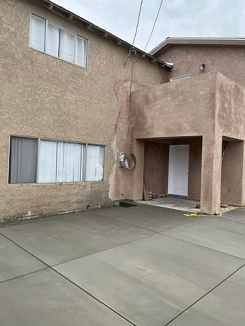 FRONT DOOR WITH PARKING SPACES
