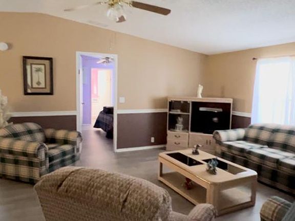 Living room, view into master bedroom