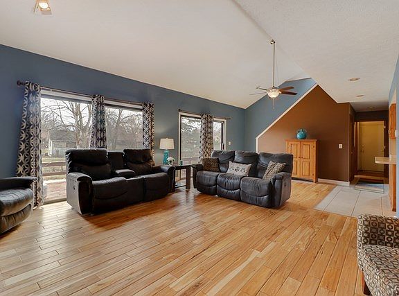 Beautiful family room with vaulted ceiling & rich hardwood flooring!