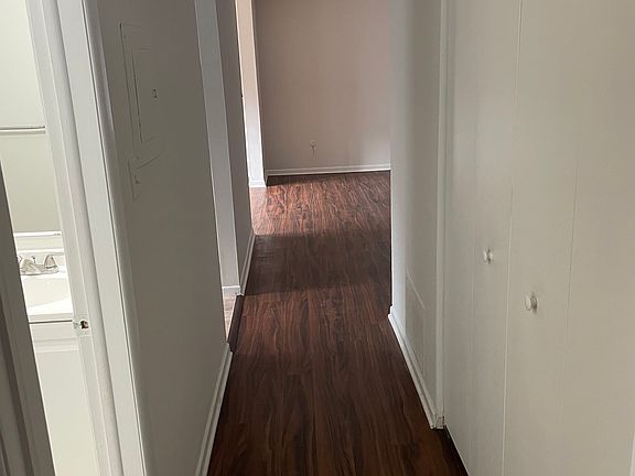 Hallway going past kitchen bathroom to the bedroom.