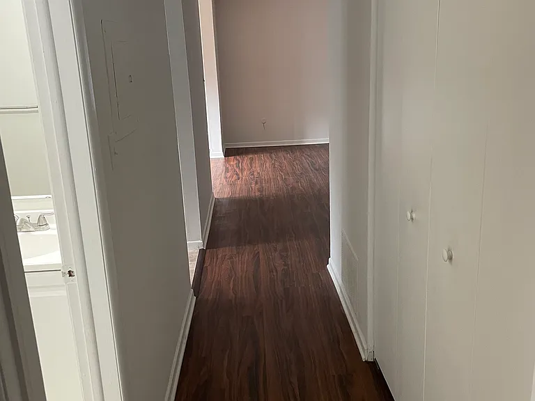 Hallway going past kitchen bathroom to the bedroom.