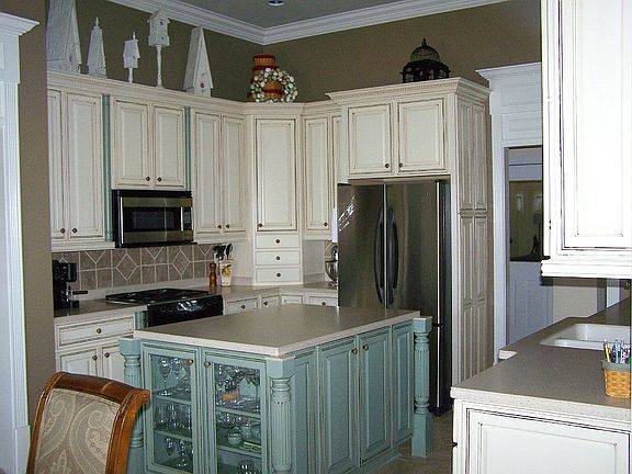 Kitchen with work island & tons of gorgeous cabinets!