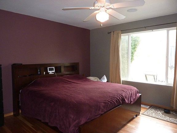 Main floor master bedroom looks out to the backyard. Enjoy the relaxing sounds of your personal waterfall on warm summer evenings.