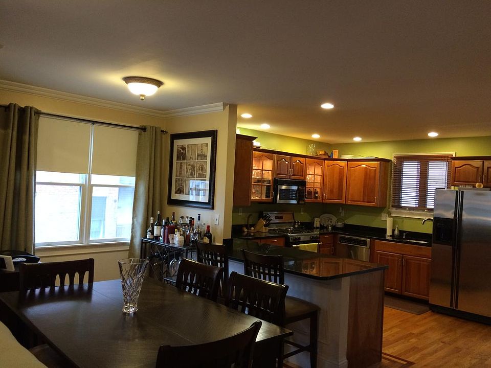 Dining area nook, breakfast bar, and kitchen
