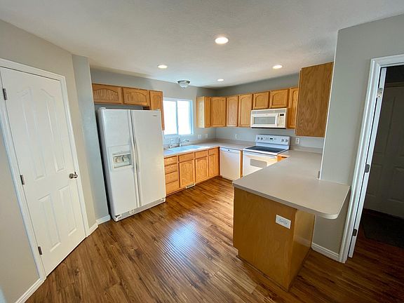 Kitchen pantry door on left. Mudroom/laundry door on the right.
