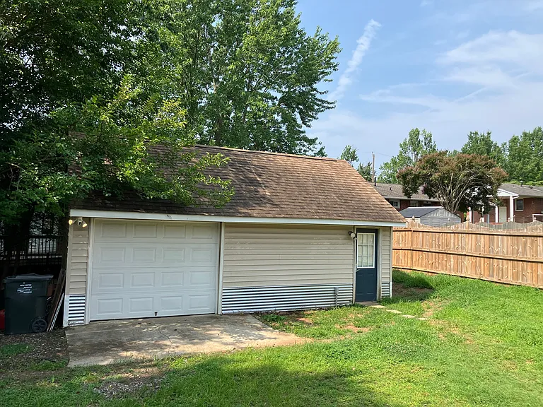 Detached temperature controlled garage with electrical, plus climate controlled attic storage above.