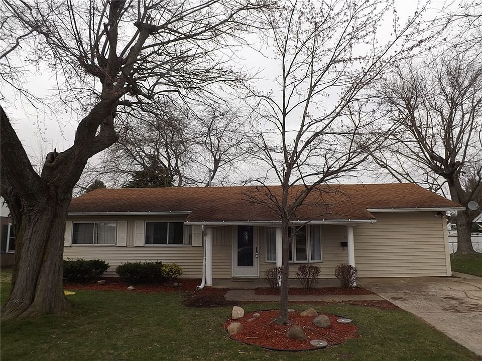 Cute house with low maintenance siding and landscaping with mature trees!