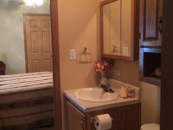 Bathroom connects to bedrms 