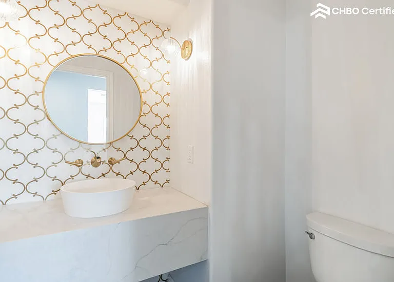 Powder Room with Marble accent wall