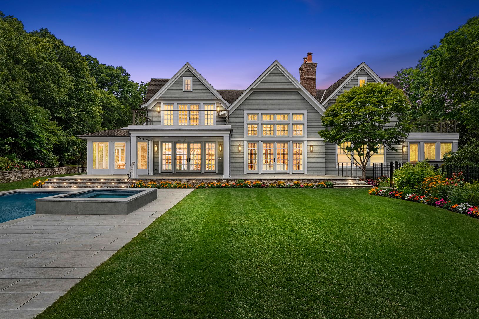  Rear View with spa, patios, and br suite balcony