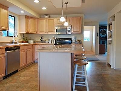 Upstairs kitchen is incredibly spacious and updated with sparkling Granite counter tops, stainless s