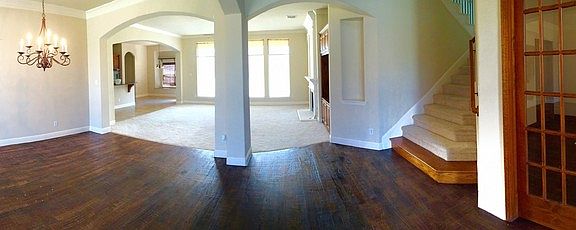 Grand entry!
						:
						Open and airy, you're greeted with a wide open floor plan.