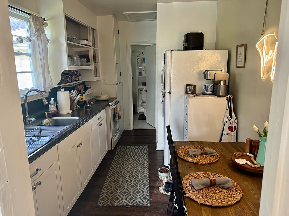 Dishwasher, Fridge and small table can fit in the large kitchen.