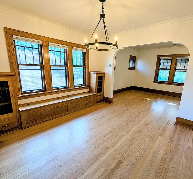 [UPPER UNIT]: newly refinished hardwood floors, build-in solid wood cabinetry, ample windows. Dining room leads into living room