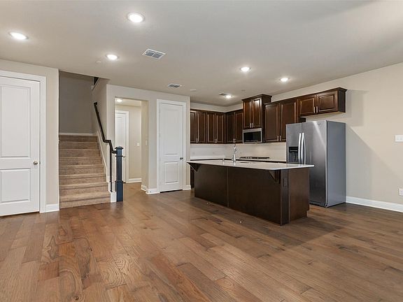 Open floor plan with wood flooring