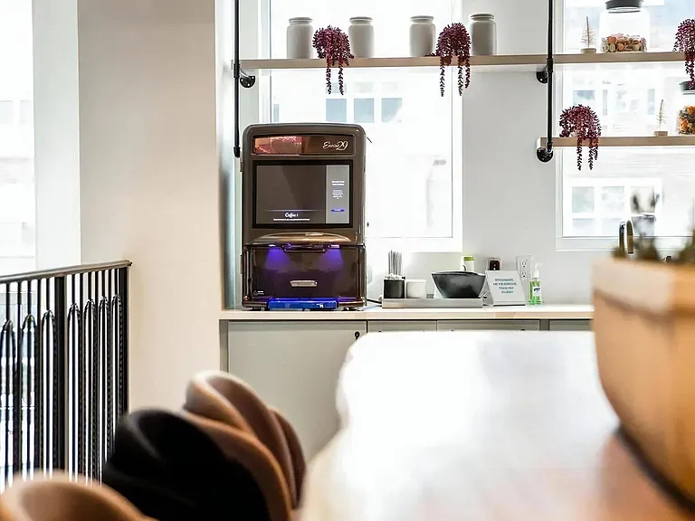 Modern Coffee Station with Sleek Equipment and Decorative Display Jars
