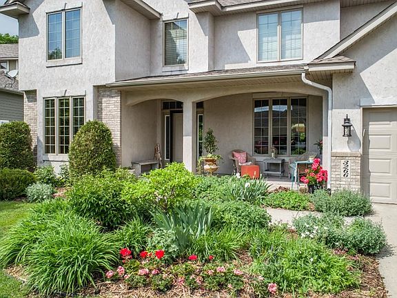 Beautiful landscaping, plantings and lush lawn. Easy care with the in-ground sprinkler system!