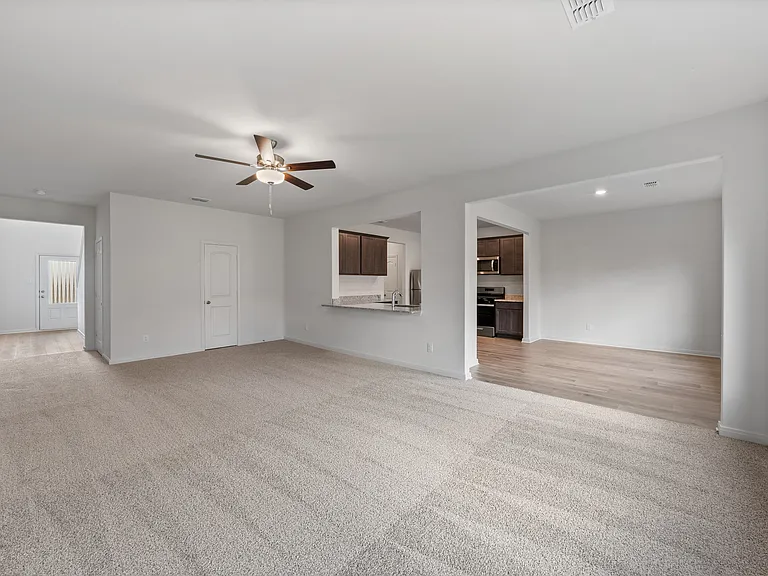 The open layout connects the family room with the kitchen and dining room.