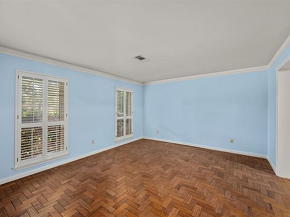 Flexible space on first floor with herringbone pattern hardwoods