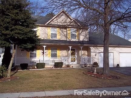 front view of house
						:
						over sized two car garage