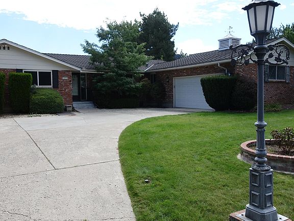 Front of the home with planter and streetlight