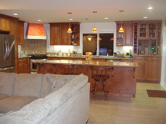 Roomy kitchen with large kitchen island.  Direct access to back yard and patio