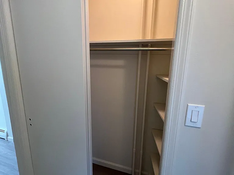 first hall closet with shelving