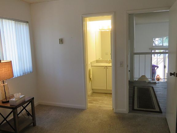 Den w/ Bathroom and through diningroom and livingroom to patio