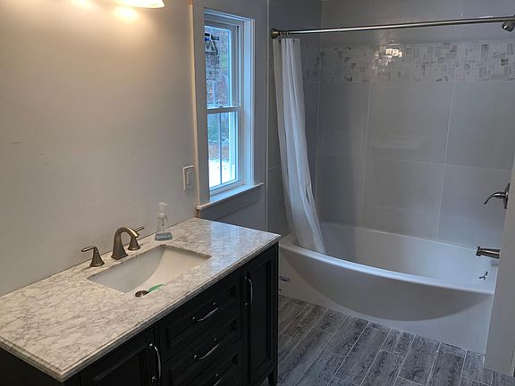 First floor bathroom custom tile floors and shower walls