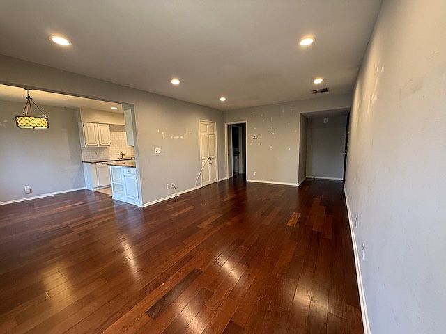 Opposite view of the living room and dining area & kitchen