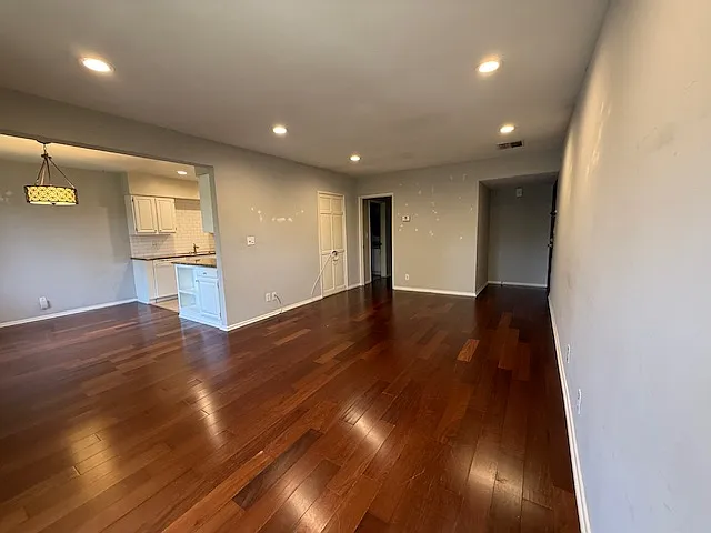 Opposite view of the living room and dining area & kitchen