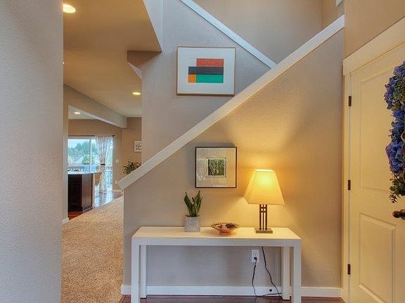 Front entry with soaring ceilings, new carpet & fresh paint!
