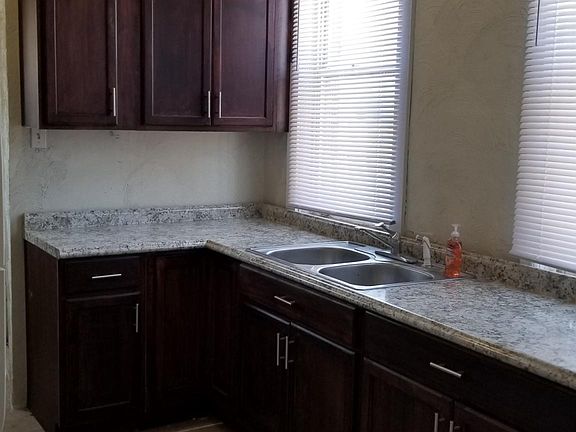 Tiled full kitchen with laundry
