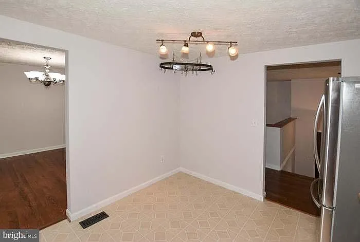 Kitchen, hallway on right, and dining room on left.