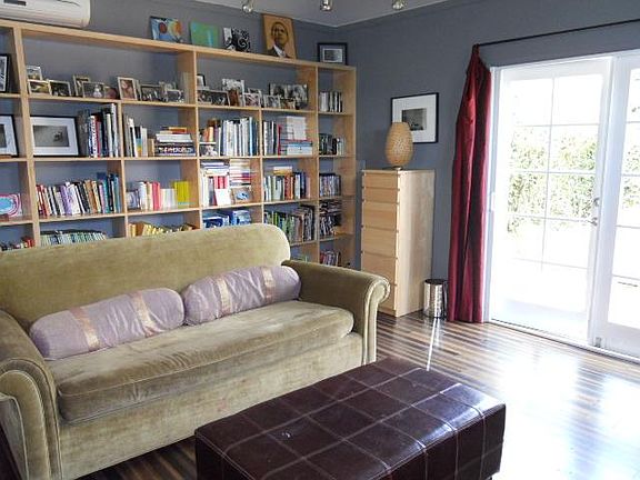 Built-in shelves line the right wall. Alternate setup. Regenerative Farming Dark Bamboo Floors. Air/Heat. Denim Insulation. Double French doors provide beautiful light. Unfurnished.