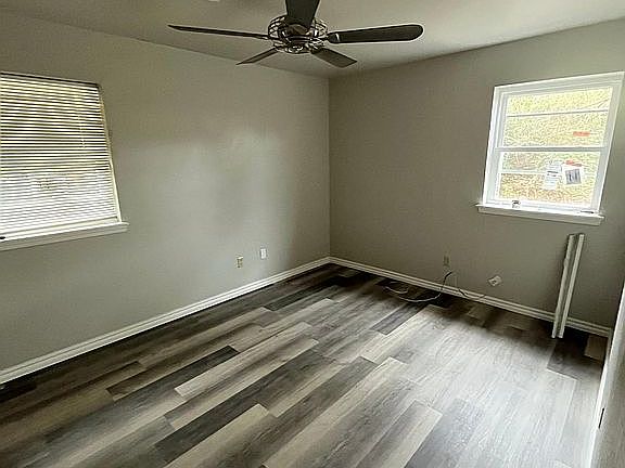 Master Bedroom with on Suite 1/2 Bath. New flooring. Ceiling Fan with Remote Control.