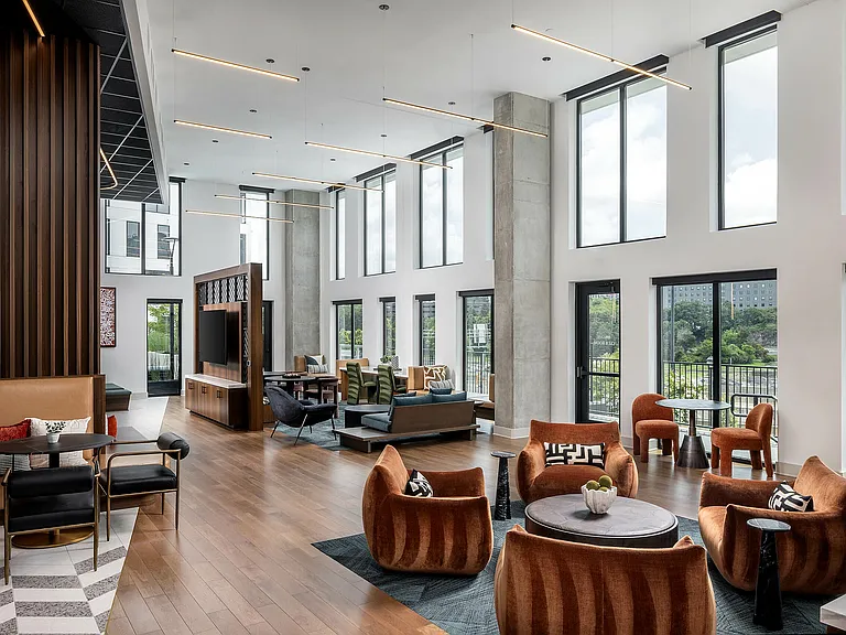 Two-story clubroom with game area and comfortable seating