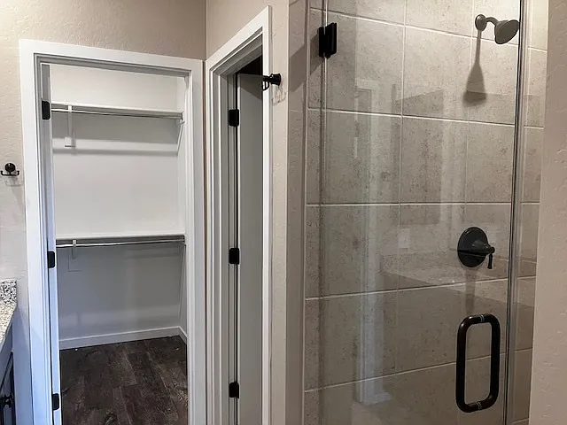 Beautiful shower, separate toilet area and walk in closet in master bath.