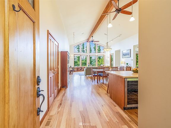 Gleaming wood craftsmanship welcomes you into the grand space.