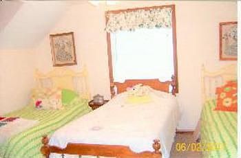 One of two large bedrooms upstairs with dormers!! And as yu can see room for lots of sleeping acommo