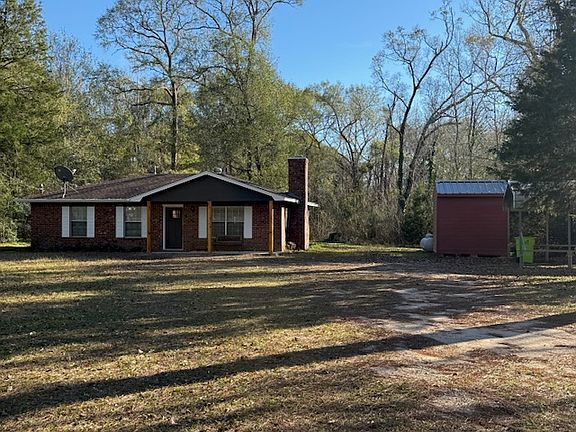 sits on 2.5 acres with car port