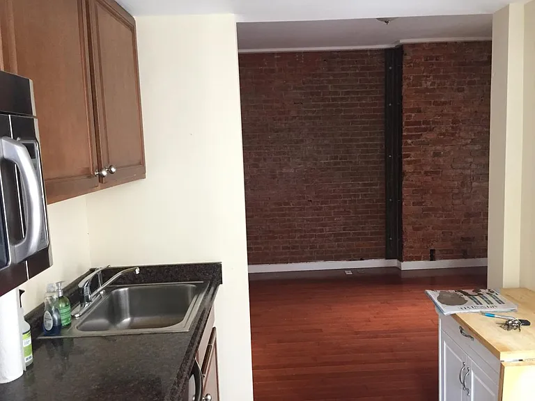 Kitchen w view to small dining area