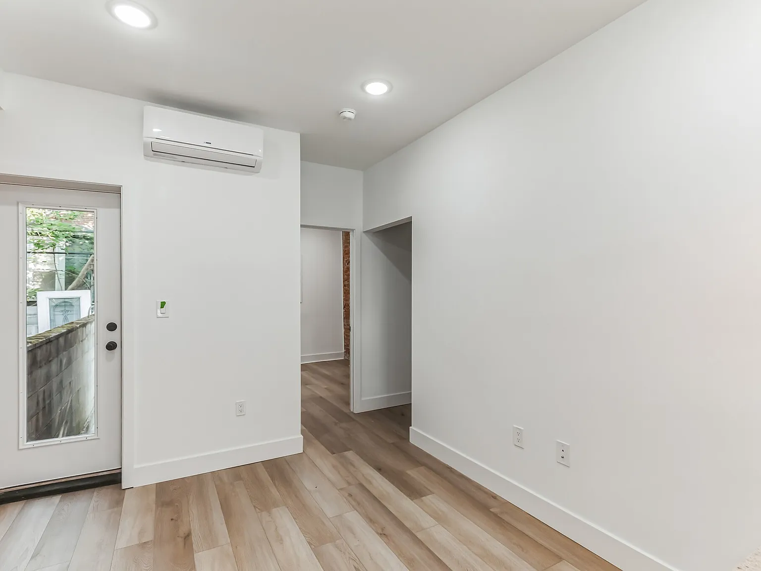 Stylish 2-Bedroom with Finished Basement, Outdoor Space & In-Unit Laundry — Photo 4