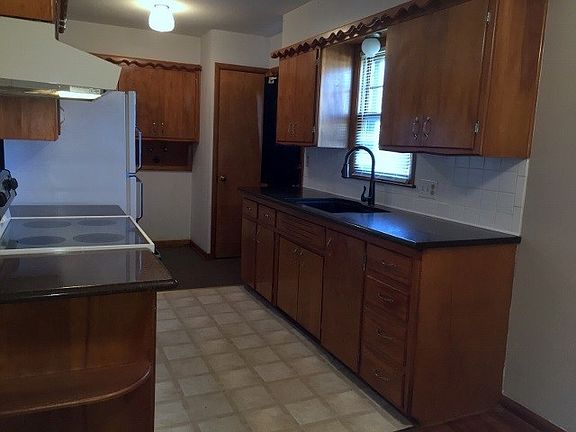 Kitchen with granite counter tops.