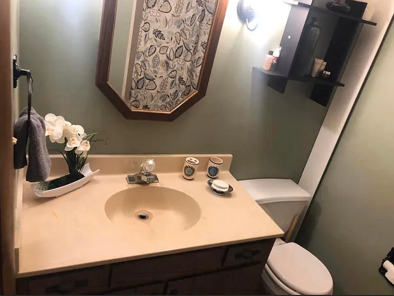 Larger vanity in bath with tub/shower combo