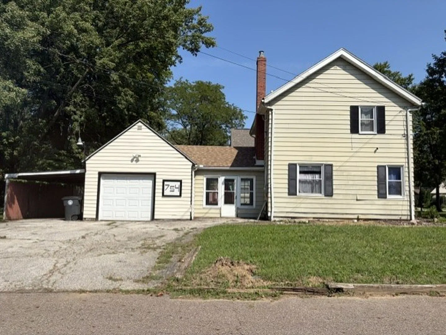 Updated 3BR Home with Open-Concept Kitchen, Bonus Lower-Level Bedroom & Garage — Photo 1