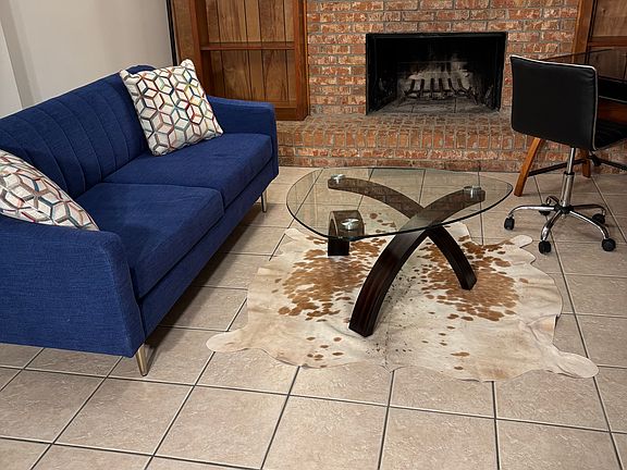 Living room with fireplace and work station