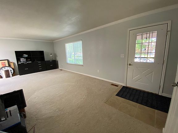 Front door and living room on middle/kitchen level.