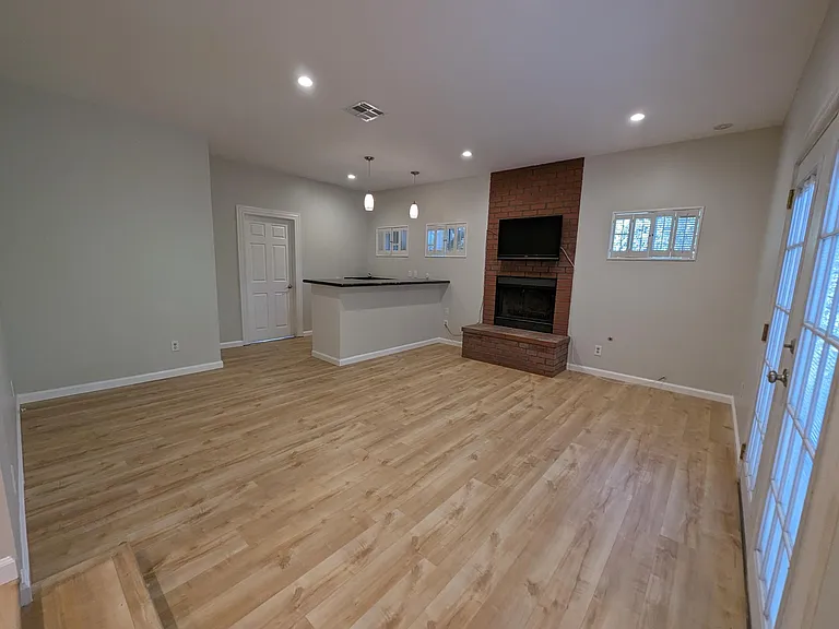 The large bonus room boasts a fire place, wet bar, and full bathroom