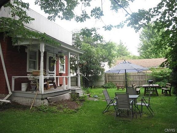 The south end of the home has plenty of room for family gatherings.  Conveniently the first room on the right where you enter is the mudroom.  Notice the white railings above for future reference.